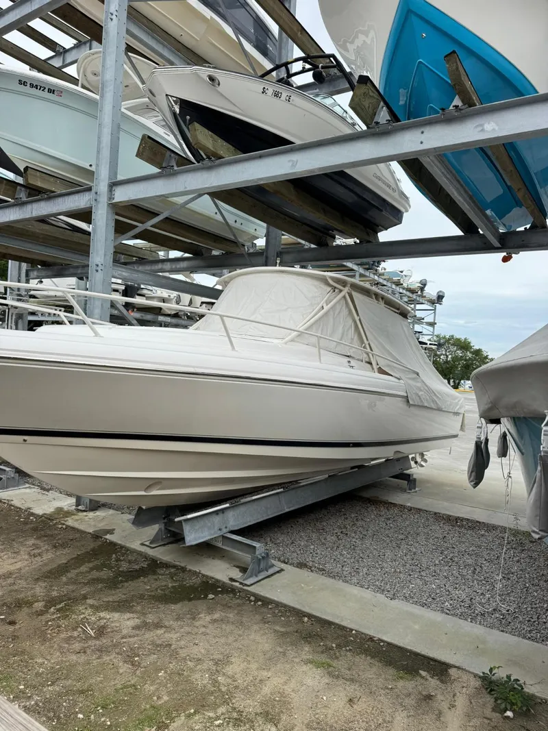Slide: The Image of 2007 Intrepid 35 Walkaround boat stored on a rack in a marina. - 11