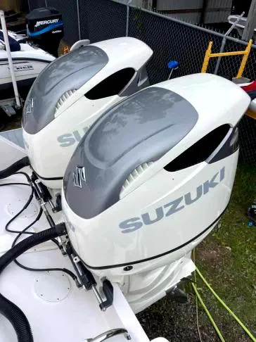 Slide: The Image of Twin Suzuki outboard motors on a 2007 Intrepid 35 Walkaround boat. - 25