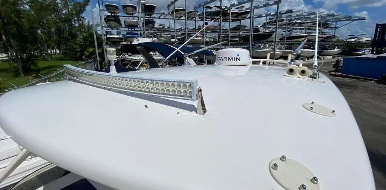 Slide: The Image of 2007 Intrepid 35 Walkaround boat with Garmin equipment, docked in a marina. - 26