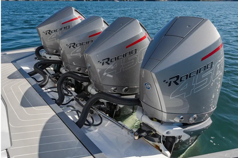 Slide: The Image of Four powerful outboard engines on a 2023 Azimut Verve 47 boat, cruising on water. - 11