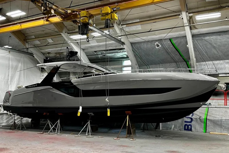 Slide: The Image of 2023 Azimut Verve 47 yacht in a workshop, elevated on stands. - 44