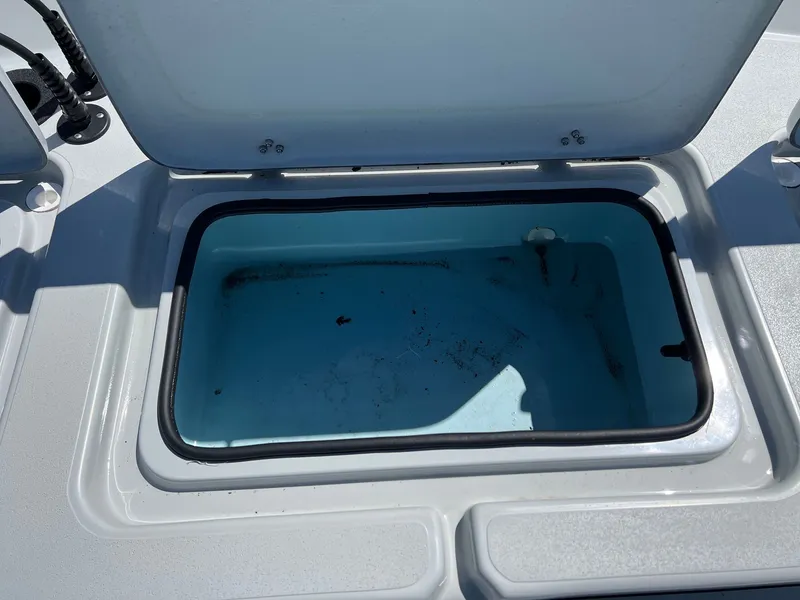 Slide: The Image of Open storage compartment on a 2026 Shoalwater 23' Catamaran. - 25