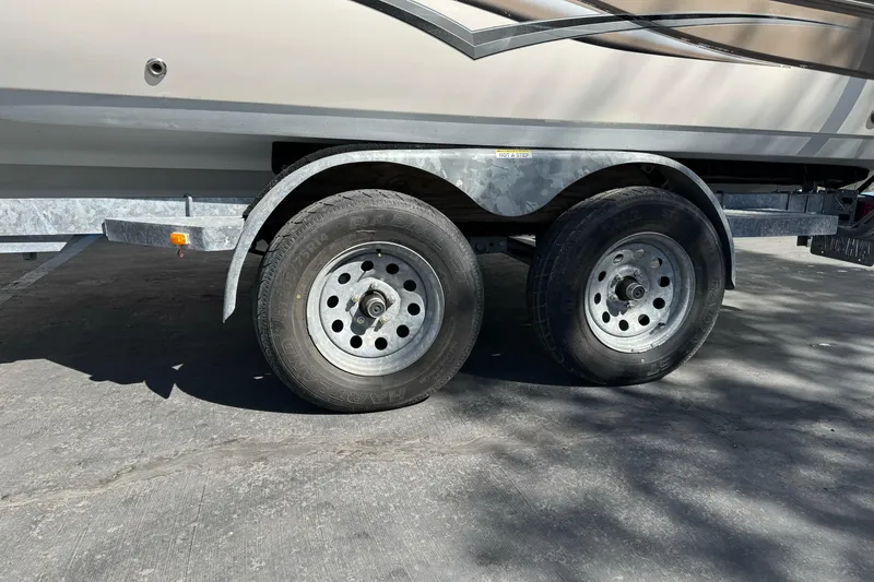 Slide: The Image of Trailer with dual wheels for 2007 Hurricane SunDeck 217 OB boat. - 1