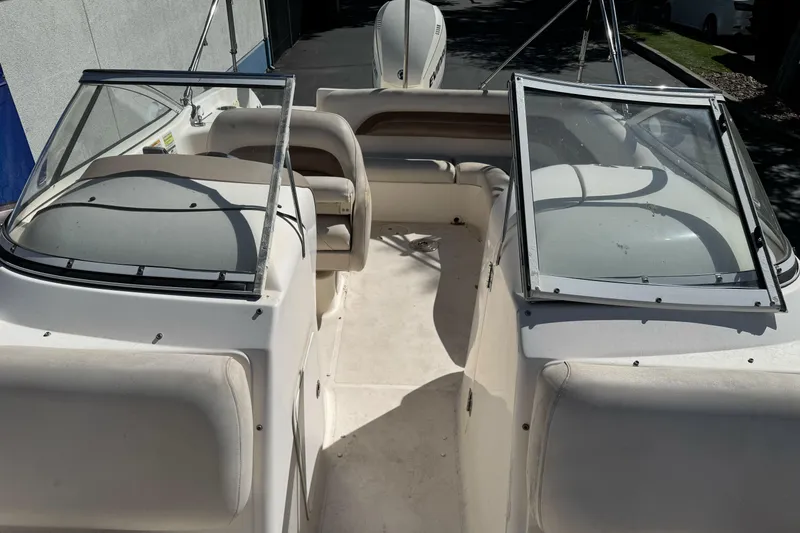 Slide: The Image of 2007 Hurricane SunDeck 217 OB boat interior with seating and windshield. - 13