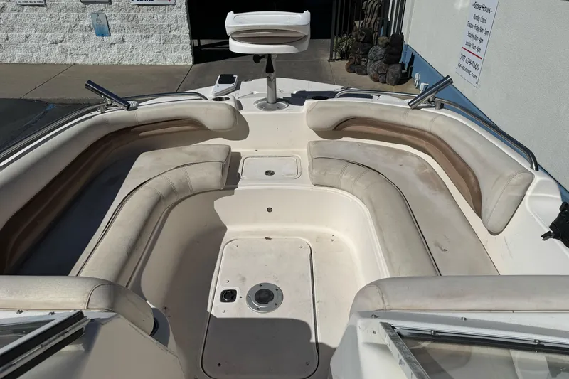 Slide: The Image of 2007 Hurricane SunDeck 217 OB boat interior with spacious seating and clean design. - 9