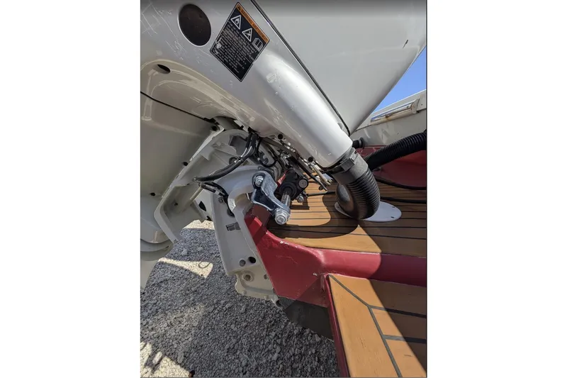 Slide: The Image of Close-up of 1989 Intrepid 29 boat engine and deck details. - 10