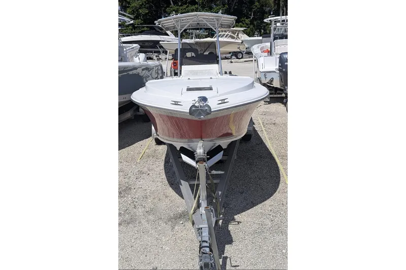 Slide: The Image of 1989 Intrepid 29 boat on trailer, parked outdoors, front view. - 3