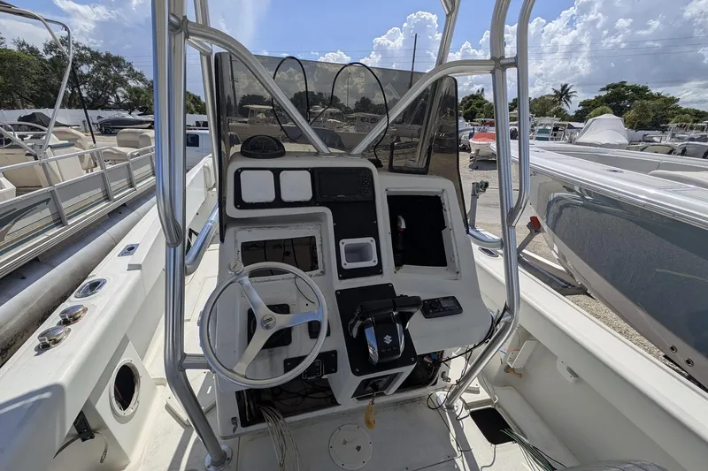 Slide: The Image of 1989 Intrepid 29 boat cockpit with steering wheel and control panel. - 7