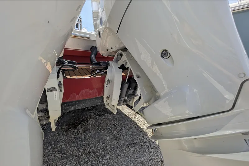 Slide: The Image of 1989 Intrepid 29 boat engines, close-up view, showing mechanical details and components. - 9