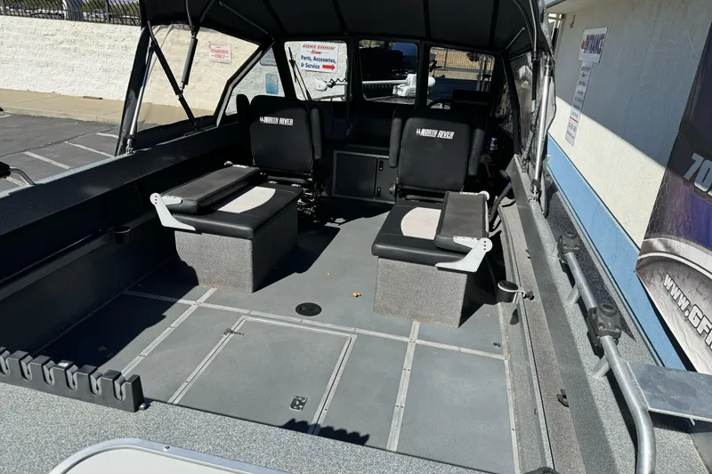 Slide: The Image of 2023 North River 21 X 84 Seahawk boat interior with seating and storage compartments. - 10