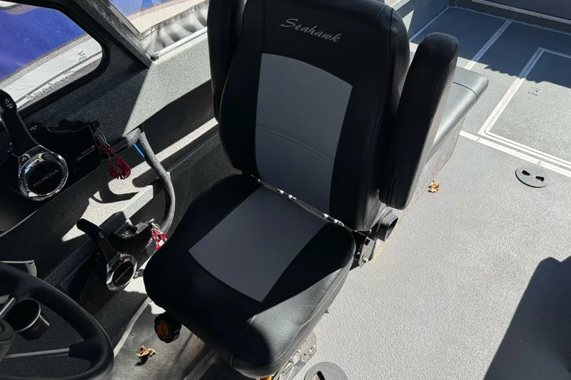 Slide: The Image of 2023 North River 21 X 84 Seahawk boat interior with steering and seating. - 18