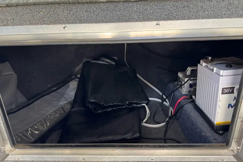 Slide: The Image of Storage compartment of 2023 North River 21 X 84 Seahawk with battery and equipment. - 24