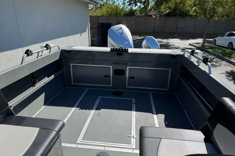 Slide: The Image of 2023 North River 21 X 84 Seahawk boat interior with seating and storage compartments. - 25