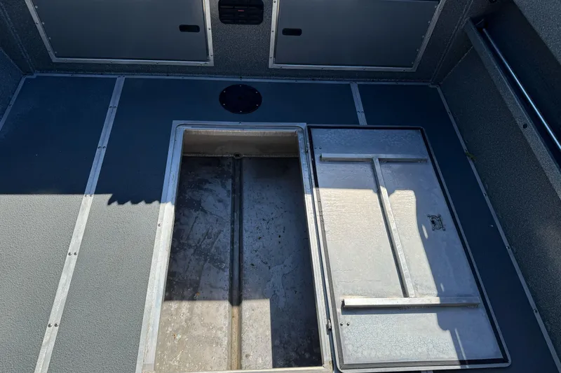 Slide: The Image of 2023 North River 21 X 84 Seahawk boat interior with open storage compartment. - 26