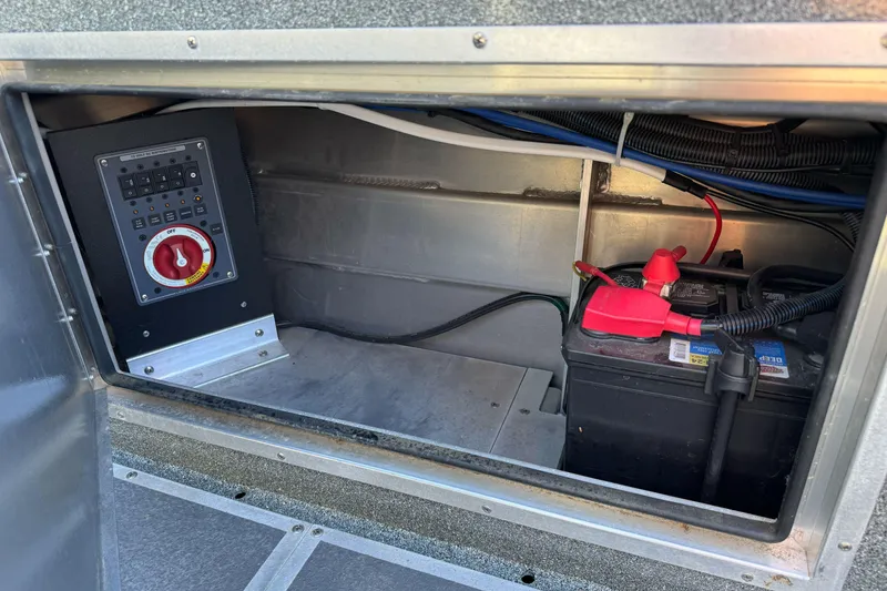 Slide: The Image of 2023 North River 21 X 84 Seahawk battery compartment with control panel and wiring. - 27