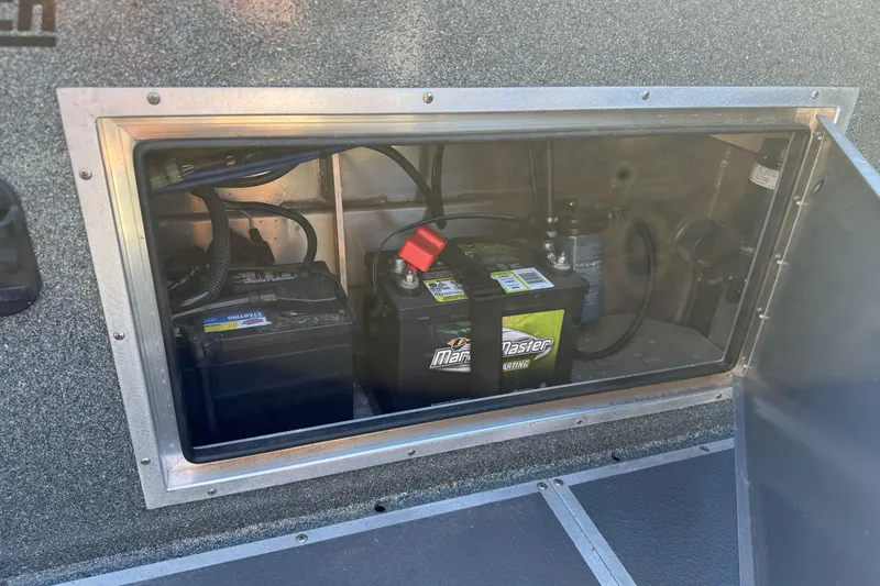 Slide: The Image of Battery compartment of 2023 North River 21 X 84 Seahawk boat, featuring marine batteries. - 28