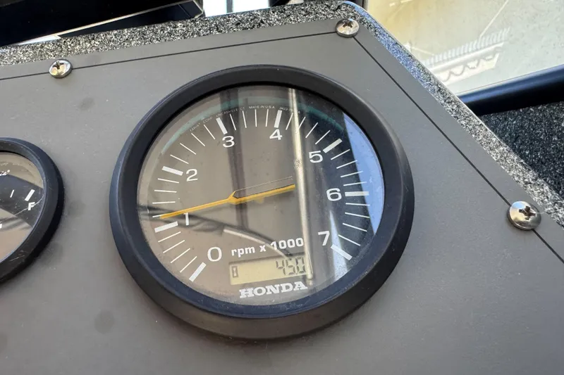 Slide: The Image of Close-up of a Honda tachometer on a 2023 North River 21 X 84 Seahawk boat. - 29