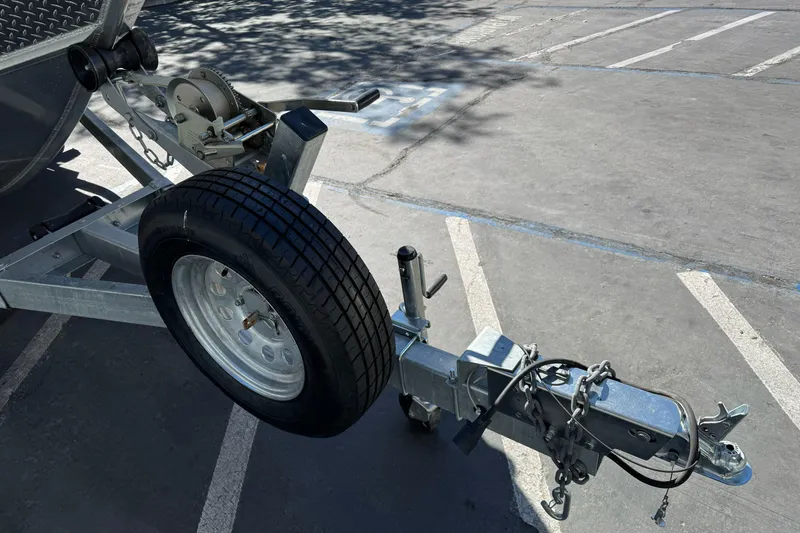 Slide: The Image of Trailer hitch and wheel of 2023 North River 21 X 84 Seahawk boat. - 3