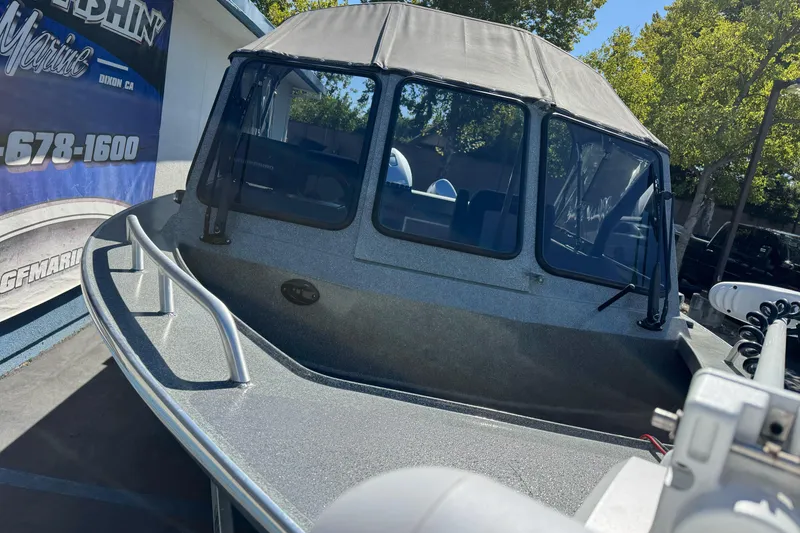 Slide: The Image of 2023 North River 21 X 84 Seahawk boat with canopy, displayed outdoors. - 4