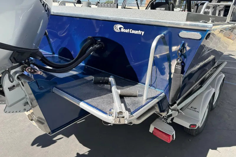 Slide: The Image of 2023 North River 21 X 84 Seahawk boat on trailer, featuring outboard motor. - 8