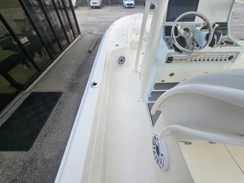 Slide: The Image of Interior view of 2024 ShearWater 25 LTZ boat deck and helm console. - 15
