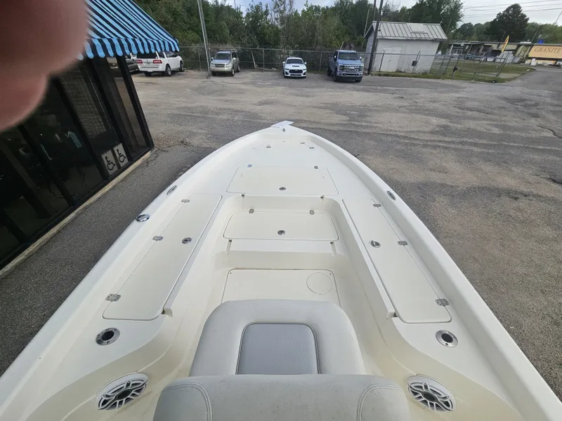 Slide: The Image of 2024 ShearWater 25 LTZ boat bow view in parking lot. - 17
