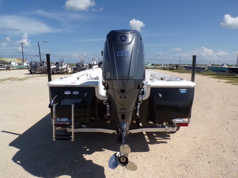 Slide: The Image of Rear view of Tidewater 2110BMT boat, 2026 model, featuring outboard motor. - 29