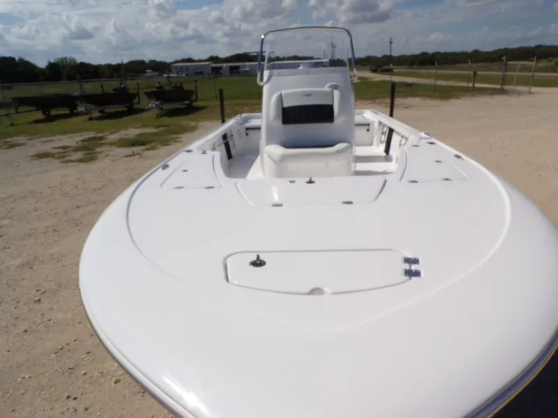 Slide: The Image of 2026 Tidewater 2110BMT boat on dry land under sunny skies. - 32