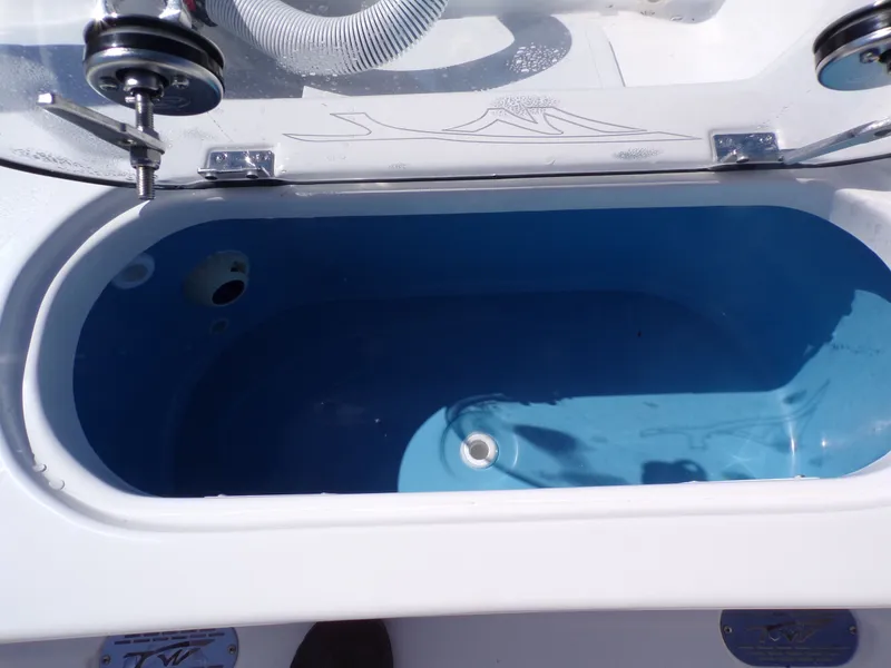 Slide: The Image of Tidewater 2110BMT 2026 boat livewell with blue interior. - 37