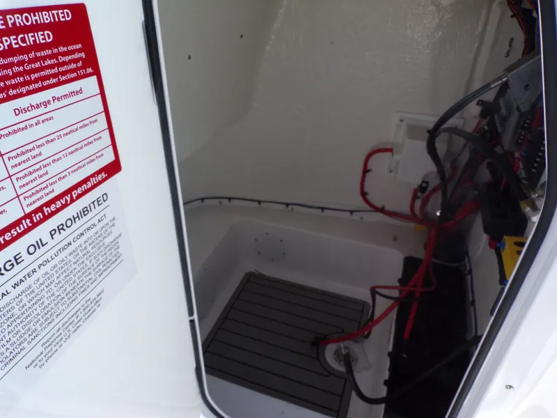 Slide: The Image of Interior of Tidewater 2110BMT 2026 with wiring and warning labels. - 44