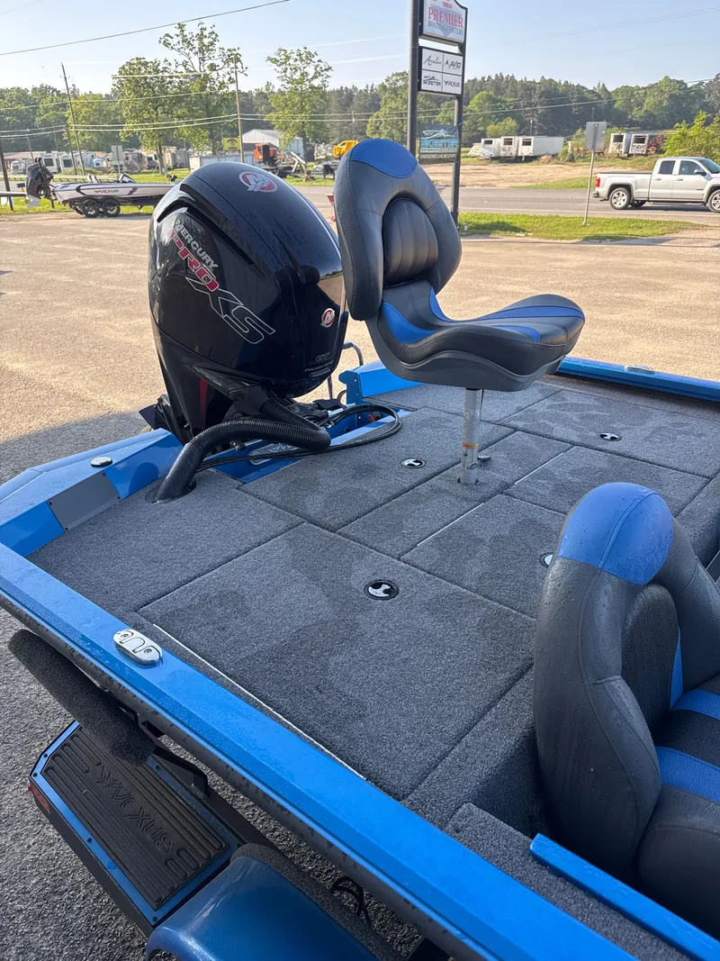 Slide: The Image of Vexus AVX1880 2025 boat with Mercury engine and blue seats. - 36
