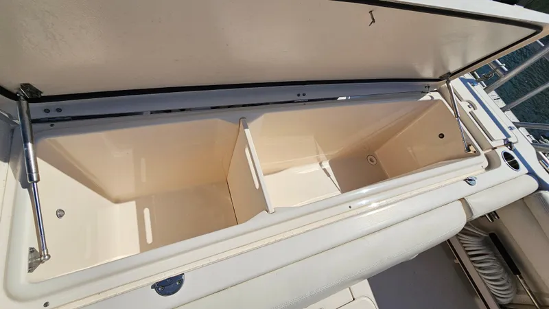Slide: The Image of Open storage compartment on a 2016 Grady-White Express 330 boat. - 17
