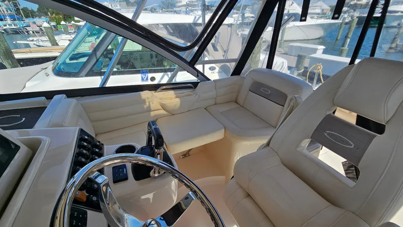 Slide: The Image of 2016 Grady-White Express 330 boat interior with plush seating and modern helm. - 32