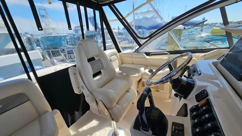 Slide: The Image of Interior of 2016 Grady-White Express 330 boat with helm and seating. - 34