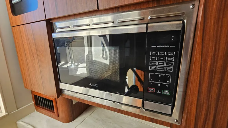Slide: The Image of Built-in microwave in 2016 Grady-White Express 330 boat kitchen. - 41