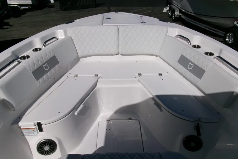 Slide: The Image of 2026 Sea Fox 268 Commander boat interior with cushioned seating and cup holders. - 10