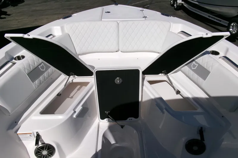 Slide: The Image of 2026 Sea Fox 268 Commander boat interior with open storage compartments and cushioned seating. - 11