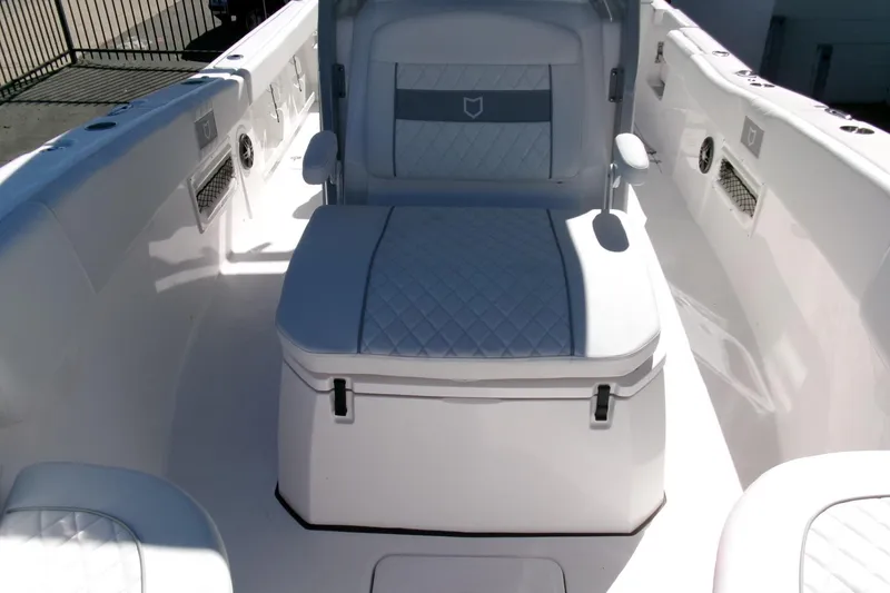Slide: The Image of 2026 Sea Fox 268 Commander boat interior with cushioned seating and storage. - 12