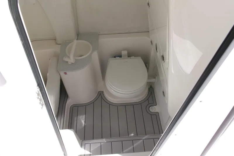 Slide: The Image of 2026 Sea Fox 268 Commander boat bathroom with toilet and sink, featuring modern design. - 15
