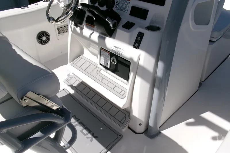Slide: The Image of 2026 Sea Fox 268 Commander boat interior with steering wheel and control panel. - 17
