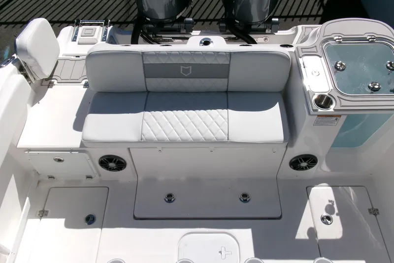 Slide: The Image of 2026 Sea Fox 268 Commander boat interior with cushioned seating and storage compartments. - 24