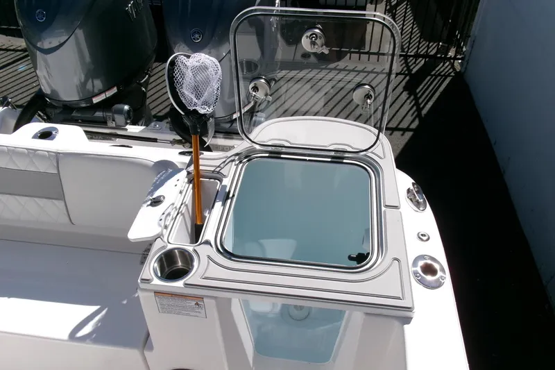 Slide: The Image of 2026 Sea Fox 268 Commander boat with open hatch and fishing net. - 28