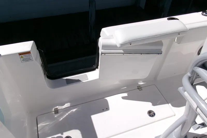 Slide: The Image of 2026 Sea Fox 268 Commander boat interior with white seating and storage compartment. - 30