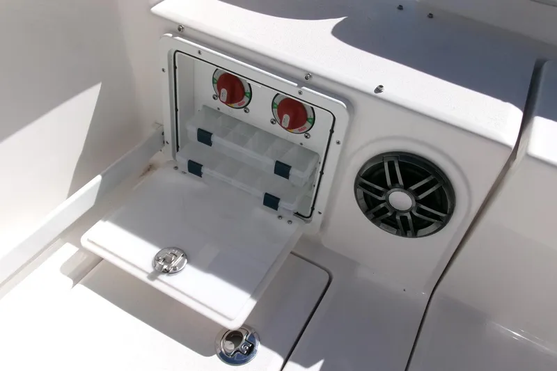 Slide: The Image of 2026 Sea Fox 268 Commander boat storage compartment with control panel and speaker. - 34
