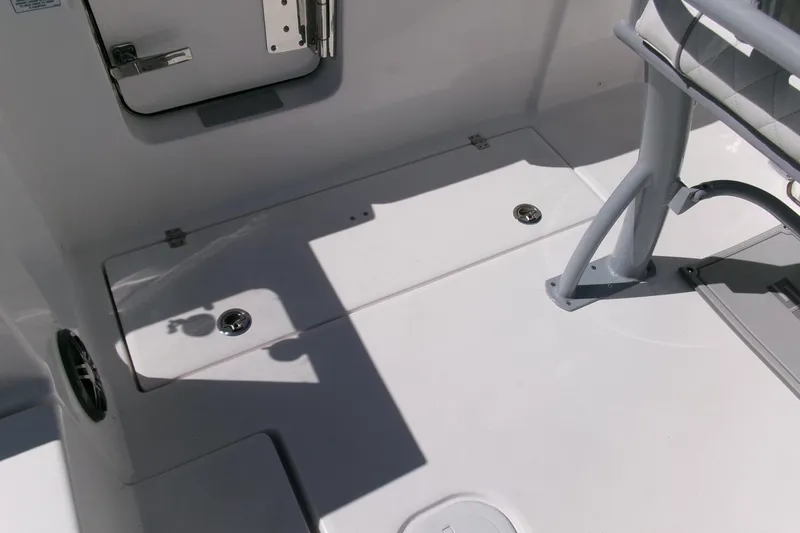 Slide: The Image of 2026 Sea Fox 268 Commander boat deck with storage compartments and seating area. - 39