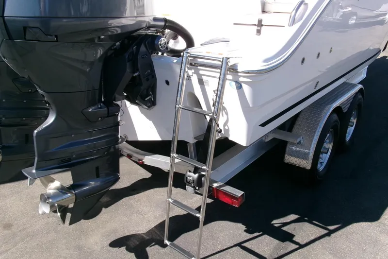 Slide: The Image of 2026 Sea Fox 268 Commander boat on trailer with outboard motor and ladder. - 41