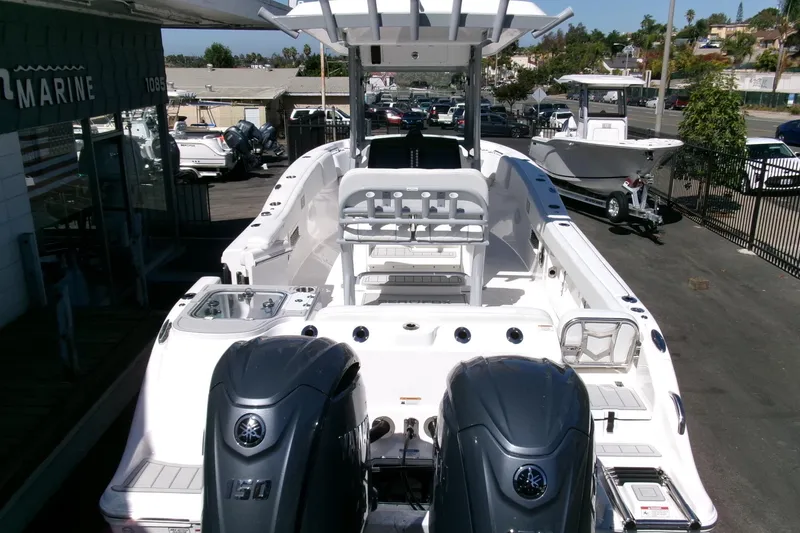 Slide: The Image of 2026 Sea Fox 268 Commander boat with dual Yamaha engines, docked at a marina. - 43