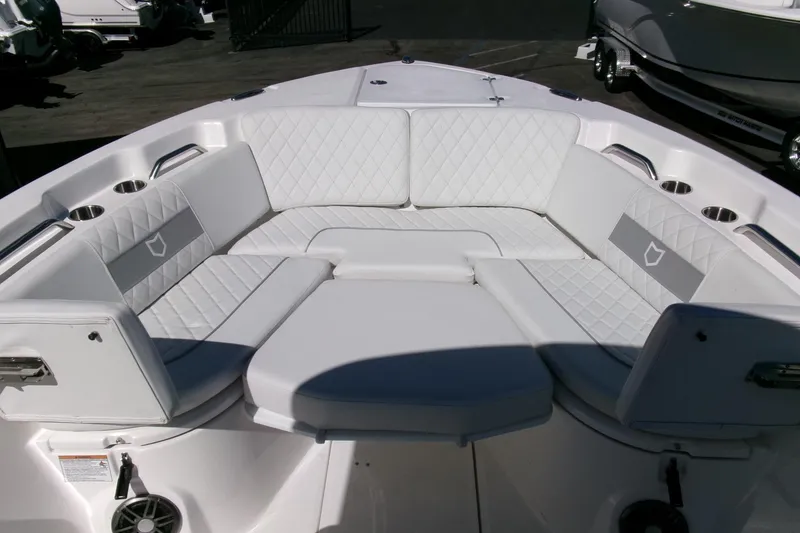 Slide: The Image of 2026 Sea Fox 268 Commander boat interior with white cushioned seating and cup holders. - 8