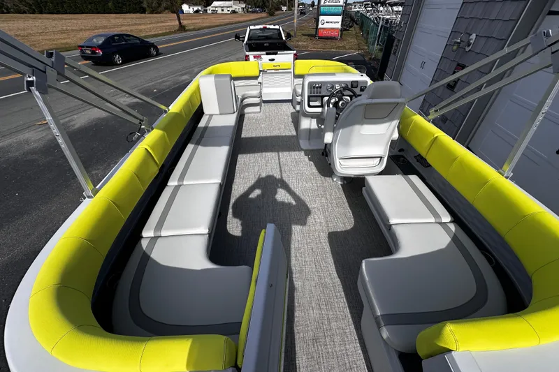 Slide: The Image of 2025 Avalon 2185 Aura Quad Lounge pontoon boat with bright yellow seating and modern design. - 12