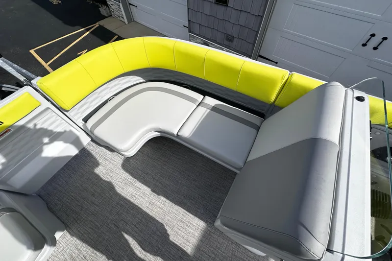 Slide: The Image of 2025 Avalon 2185 Aura Quad Lounge interior with vibrant yellow and gray seating. - 13